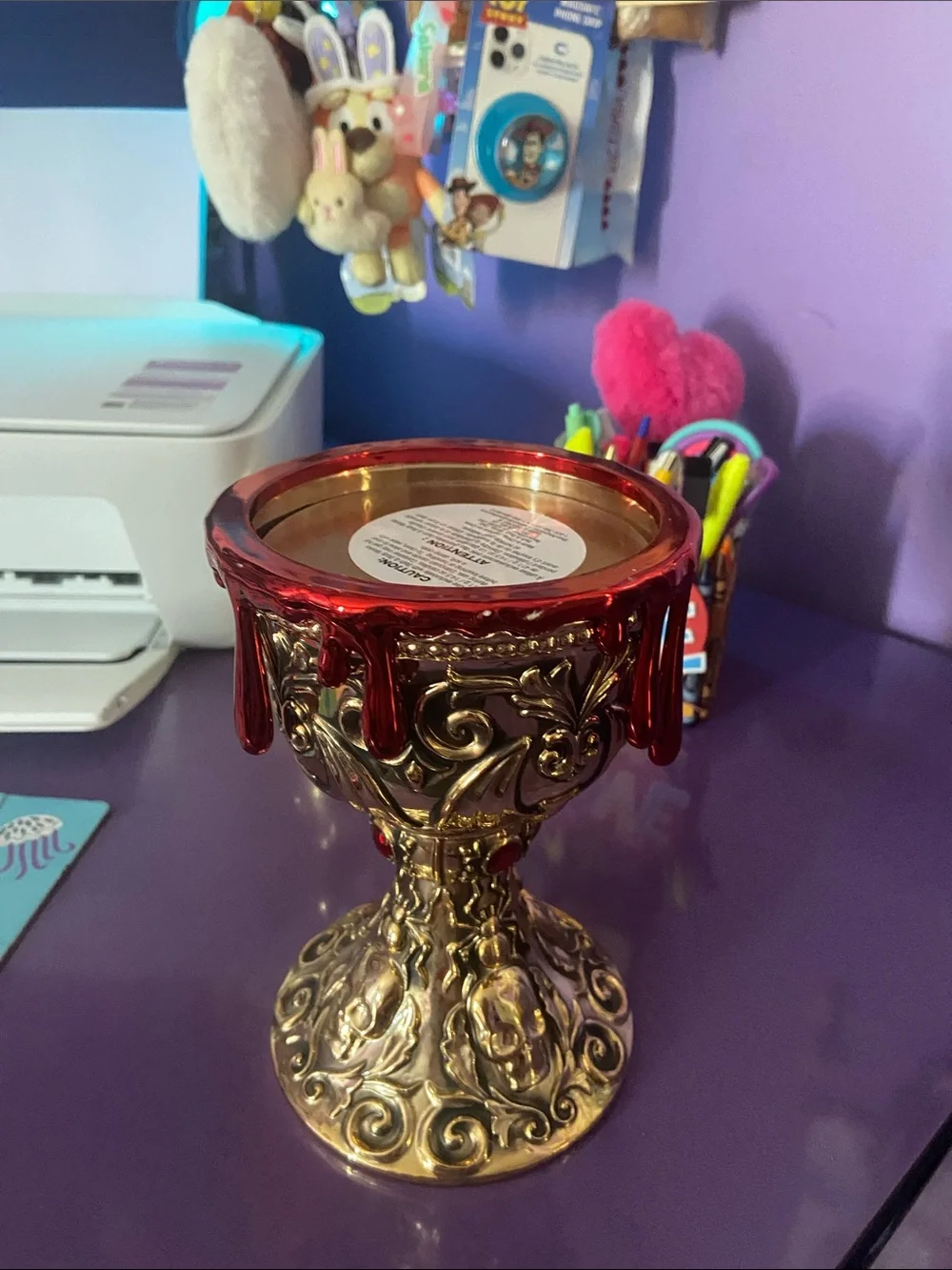 Ornate Gold Chalice Candle Holder with Red Drip Accent